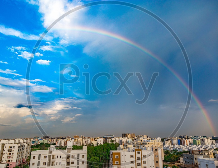 Rainbow  over Hyderabad City Scape With High Rise Buildings