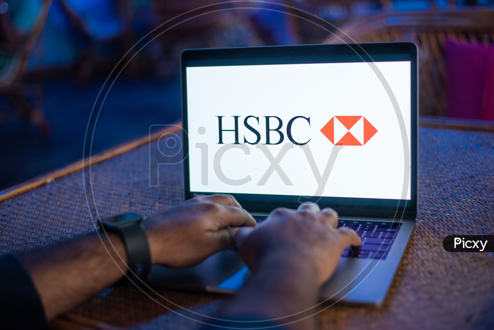 Indian Man Accessing HSBC Bank Online Portal In Laptop