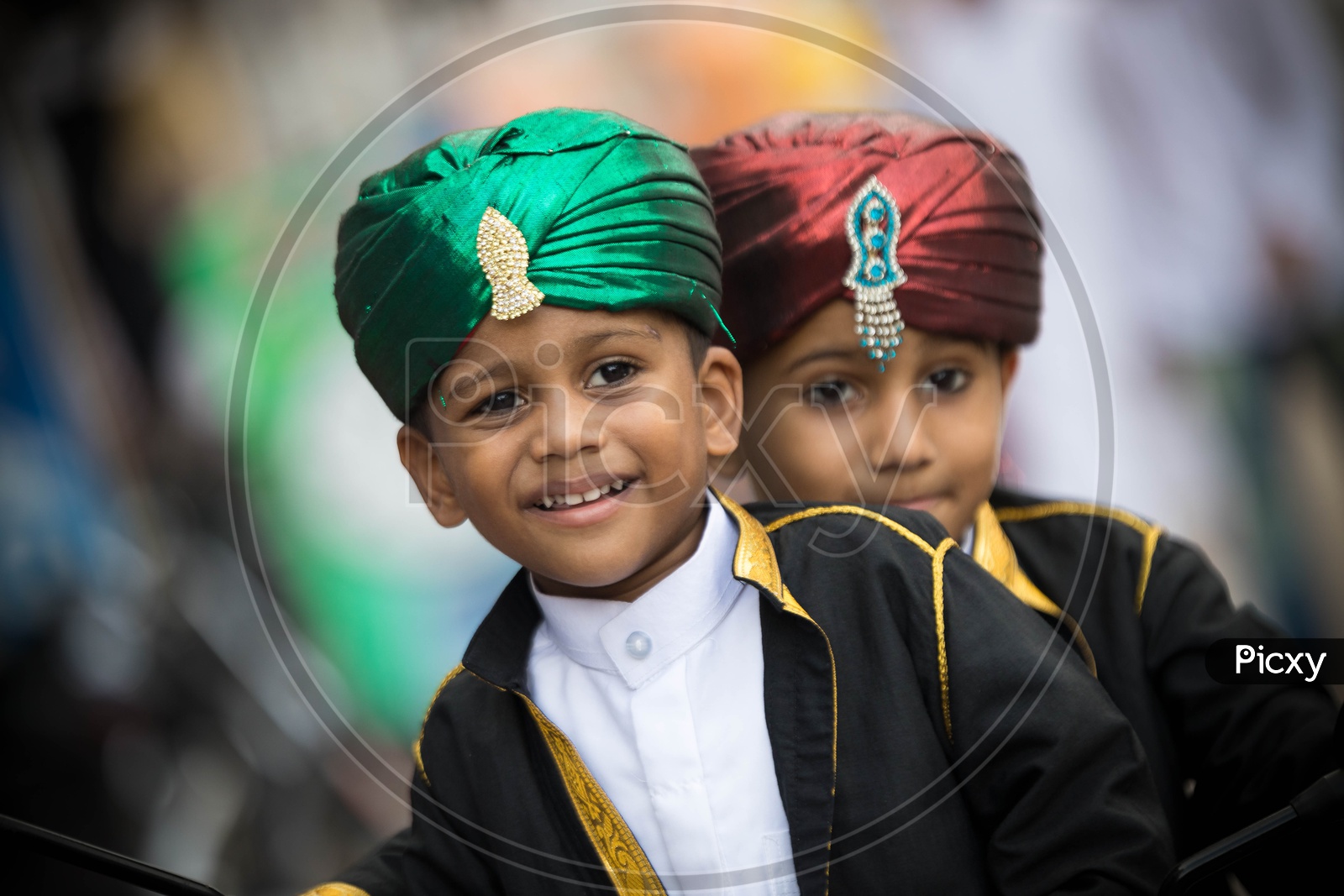 Portrait of two muslim kids wearing fancy turbans. Ramadan Celebrations.