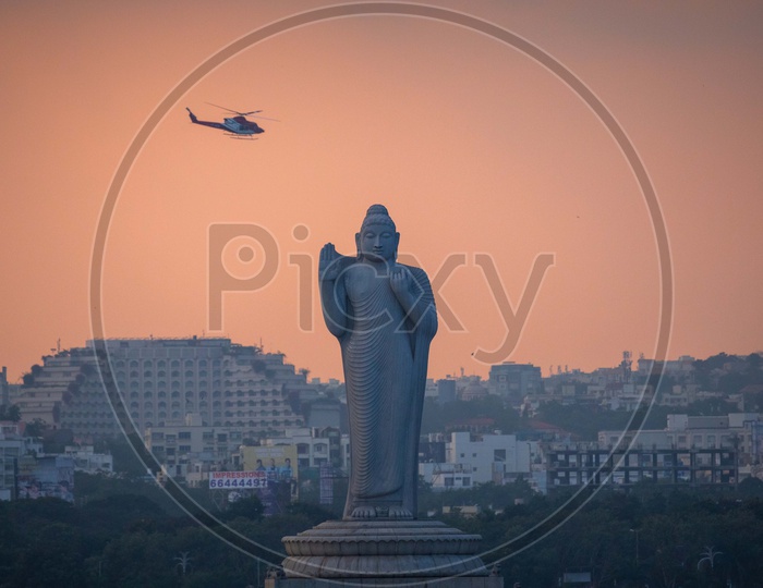Buddha Statue in Hussain Sagar and Helicopter