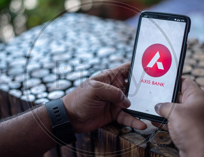 Image of Indian Man Using Axis Bank App in Smart Phone-AP219765-Picxy