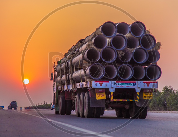 A Transport Lorry or Truck Carrying Pipes