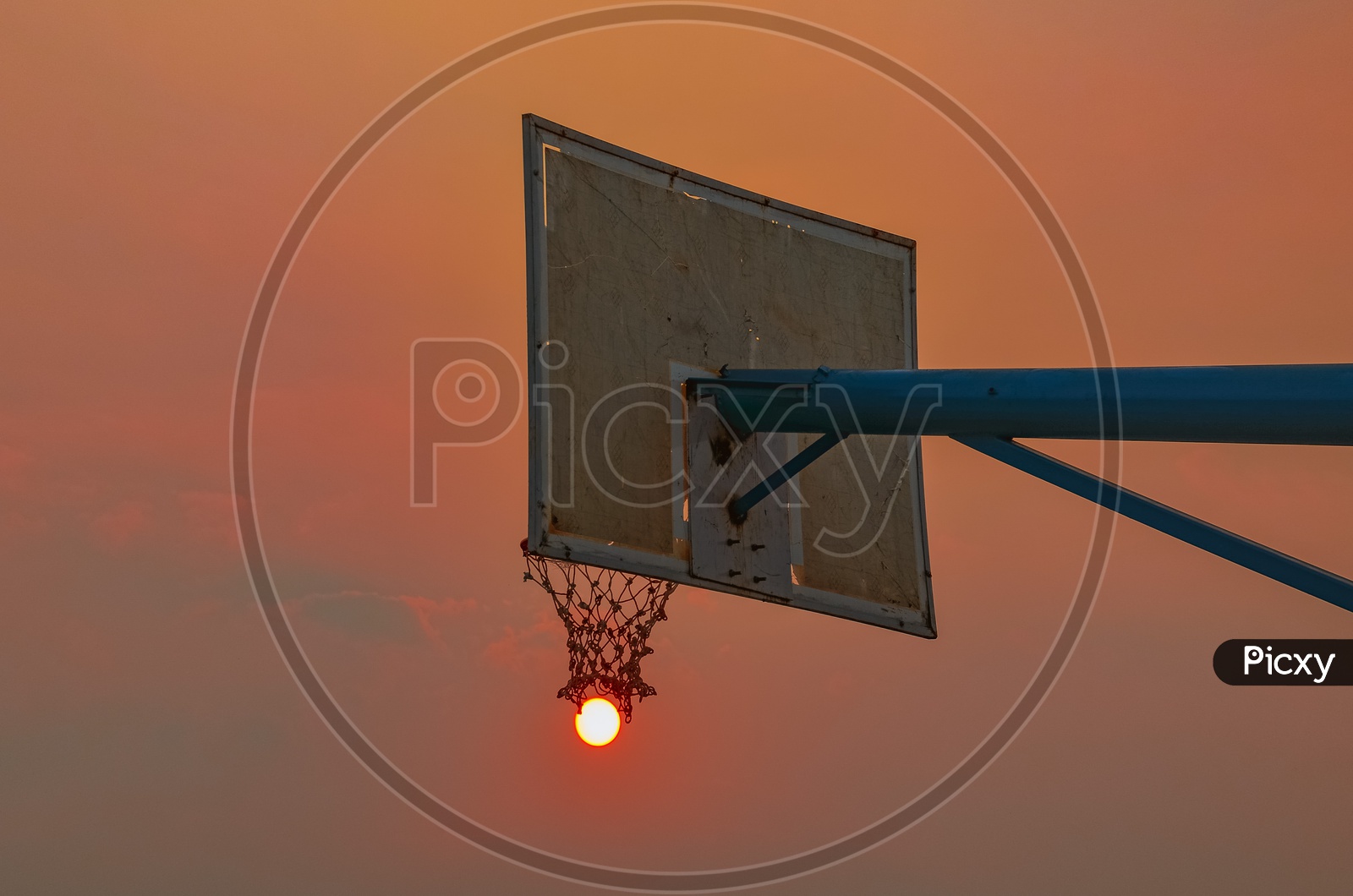 Sun and Basketball Pole