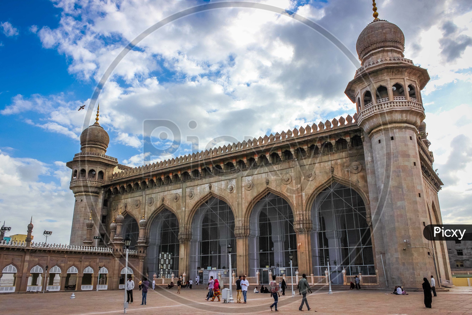 Architecture of Mecca Masjid with cloudy sky