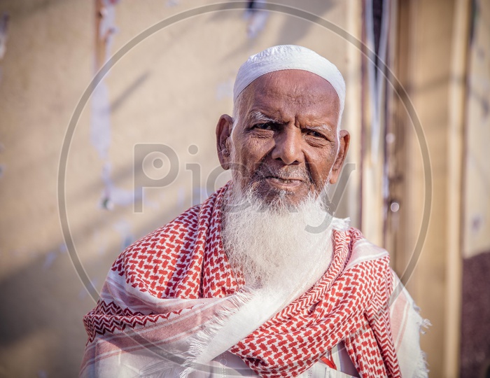 Portrait of an old muslim man with white beard