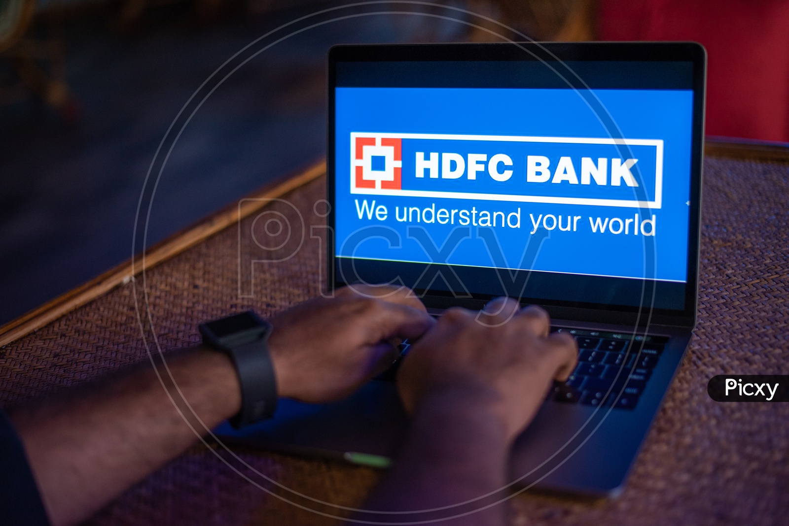 Indian Youth Accessing Online Banking Of HDFC  BANK  in Laptop