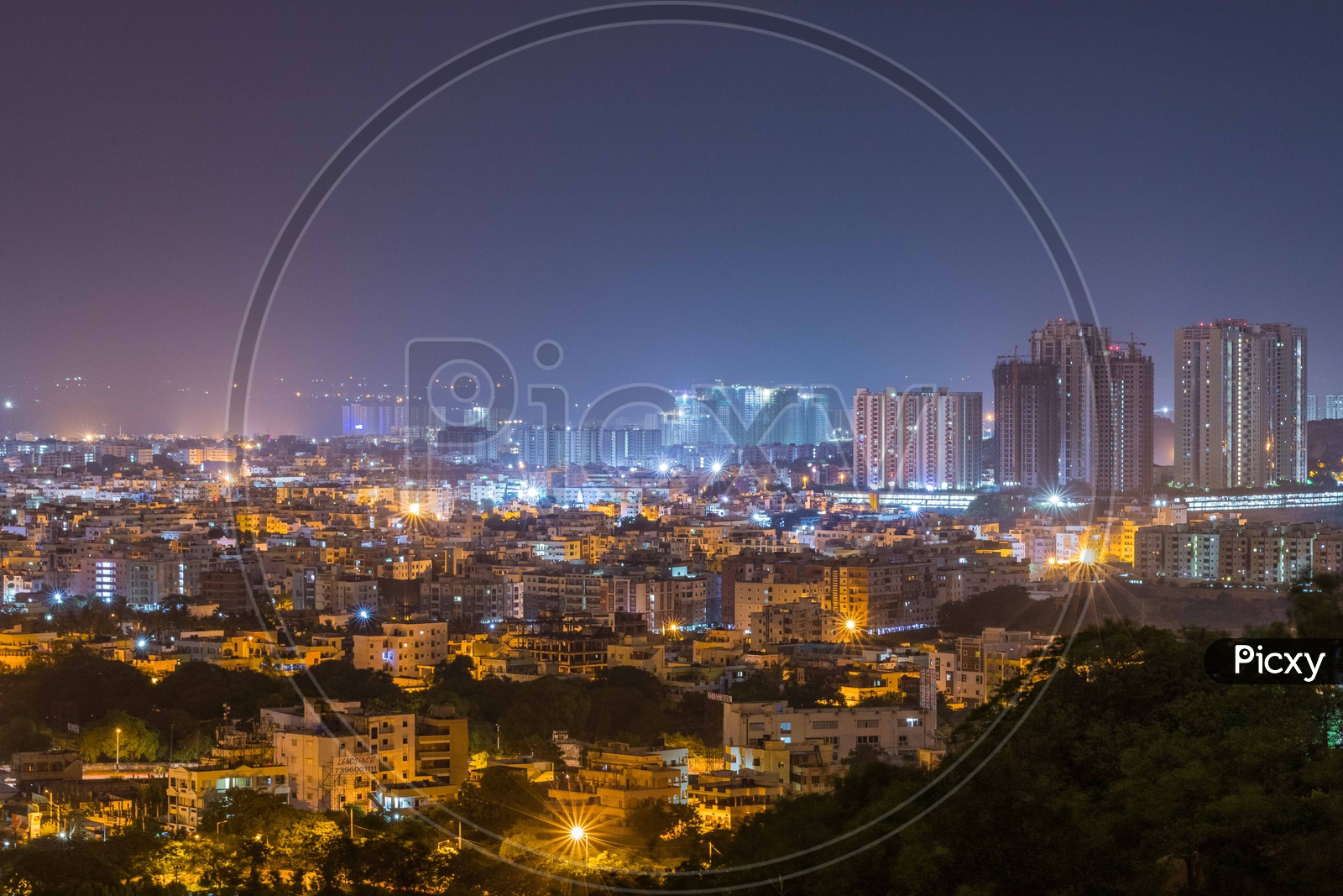 Hyderabad City Scape in Night Time With High Rise Apartments And Luminous Lights in Apartments