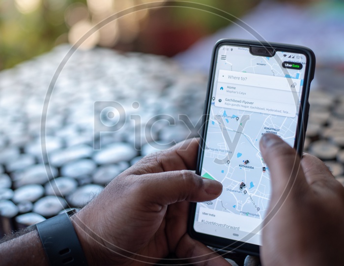 Indian Man Ordering food online in Uber Eats App from Smart Phone