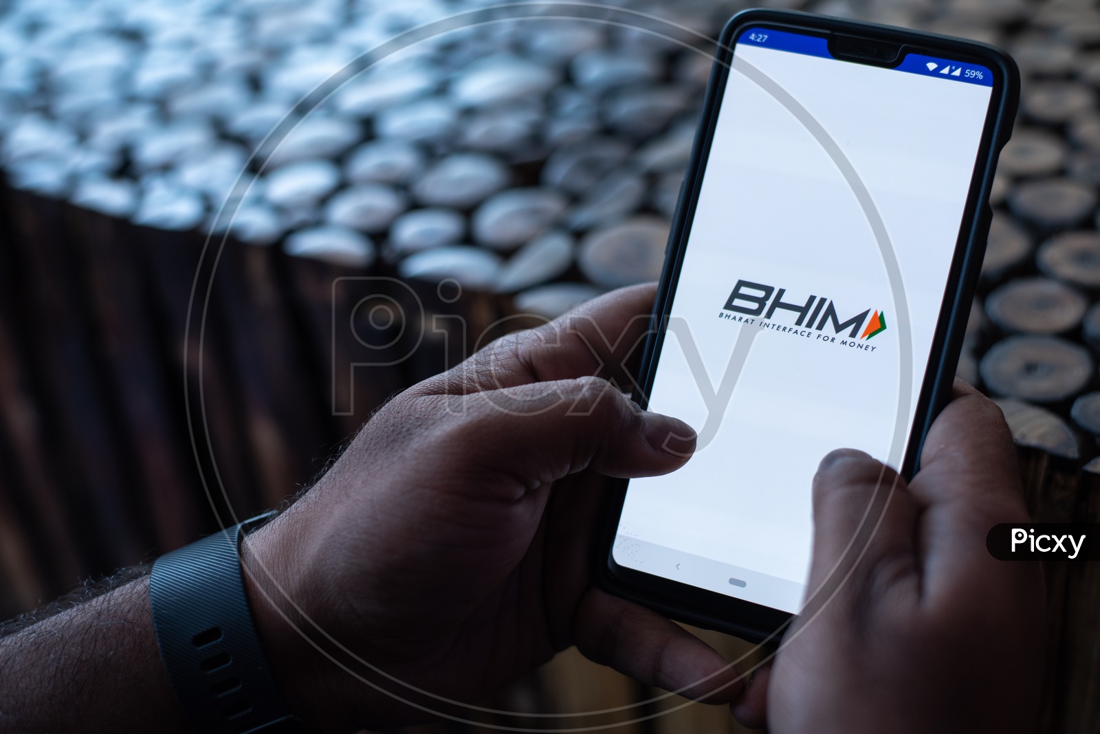 Indian Man Using BHIM UPI App in Smart Phone