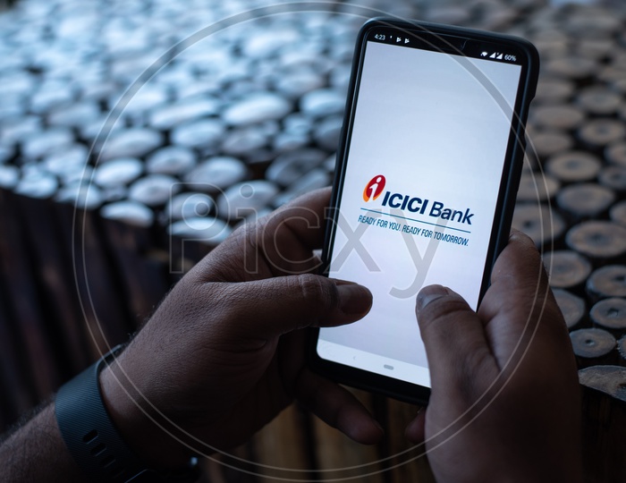 Indian Man Accessing ICICI BANK App in Smart Phone