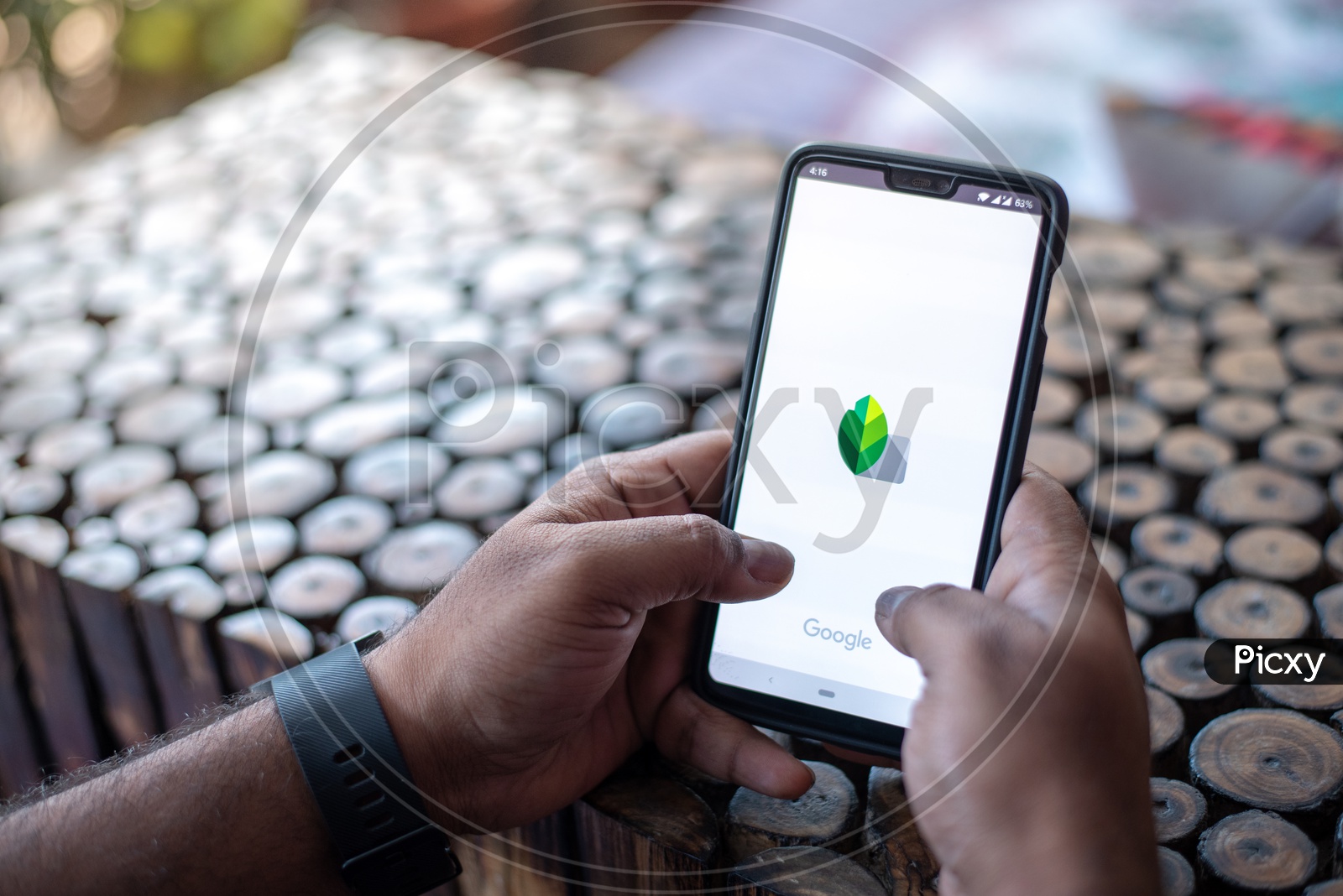 Indian Man using Snapseed App in  in Smart Phone