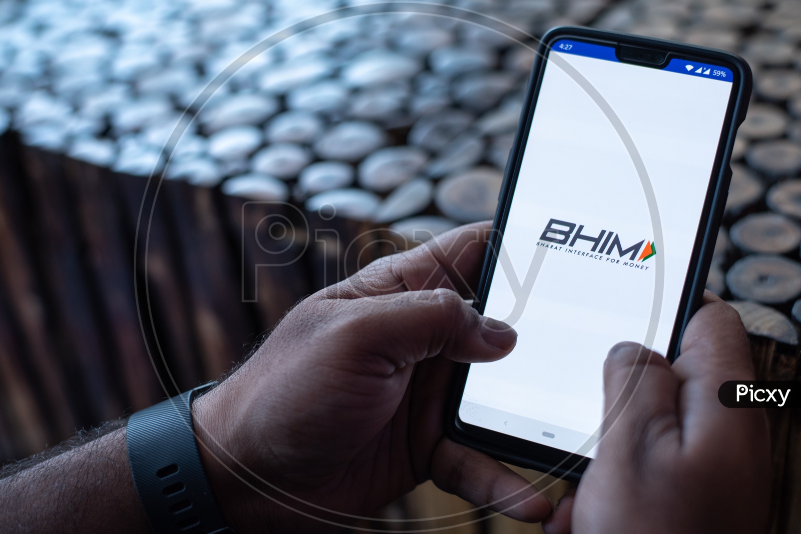 Indian Man Using BHIM UPI in Smart Phone