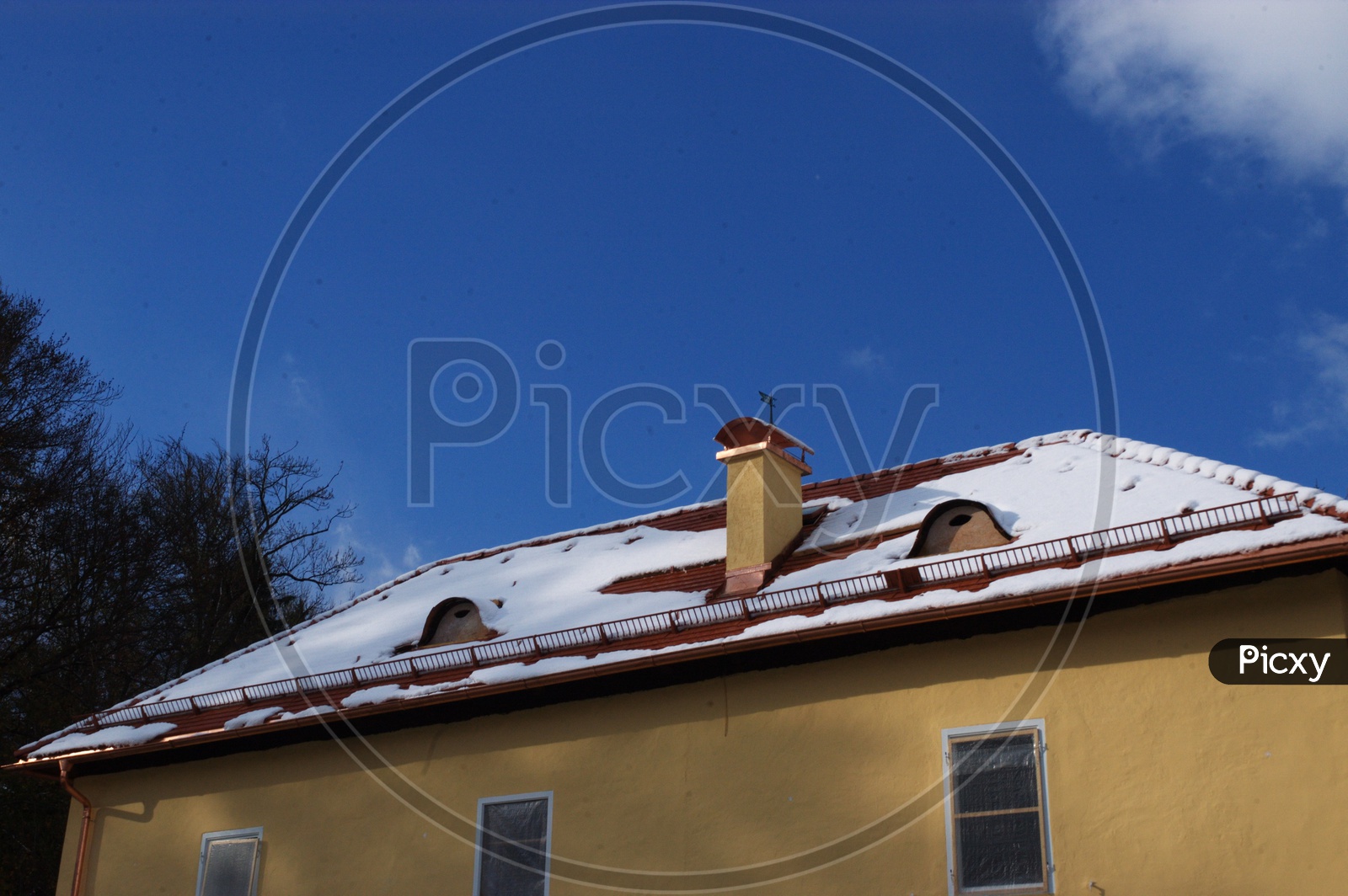Snow capped roof top of a house