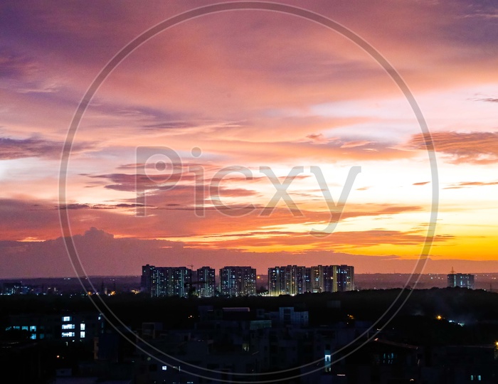 City scape view of buildings and Houses in a Residential area with golden hour Sky as background
