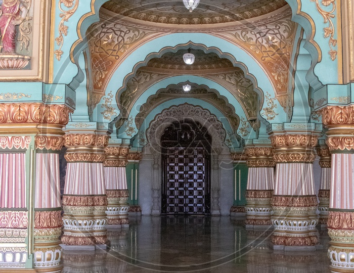 Architecture Of Mysore Palace With Designs On Pillars ,  Corridor and Antique Door