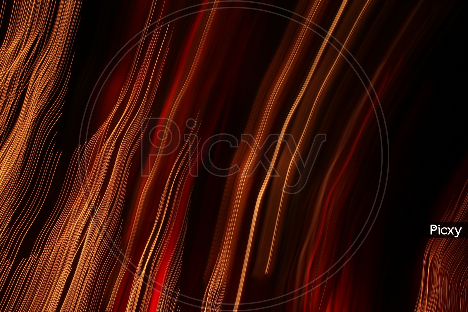 Abstract blurred light trail pattern with black background