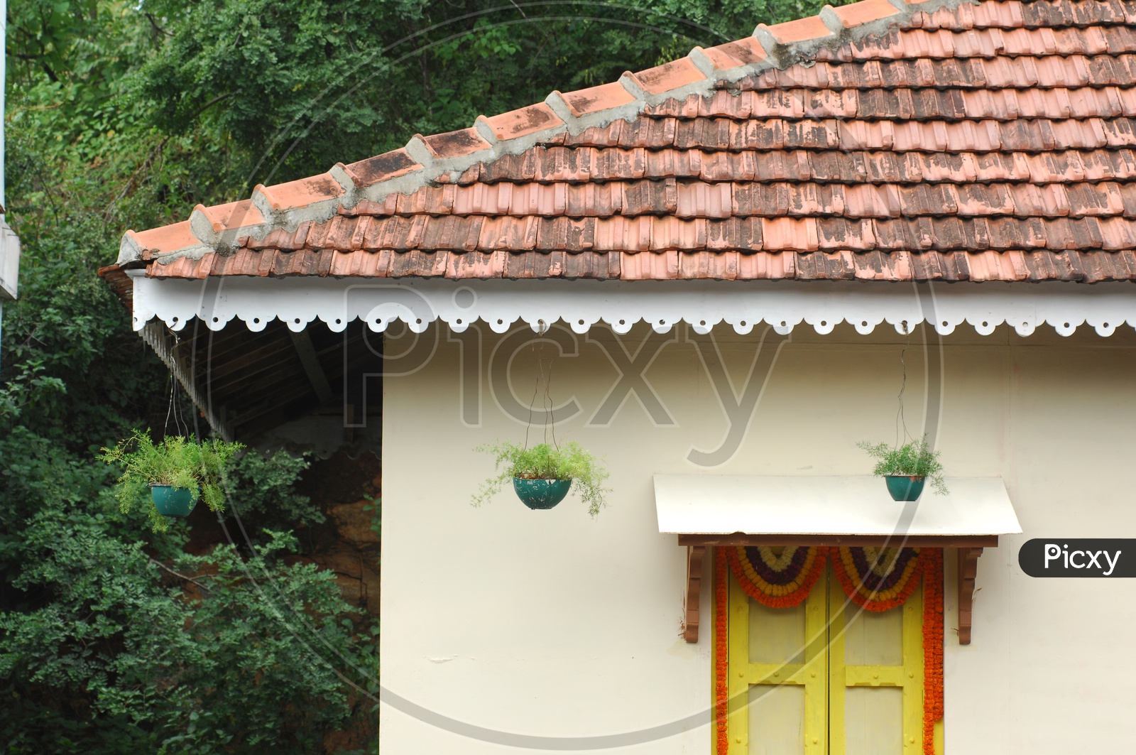 Roof of a house with flower decorated entrance door