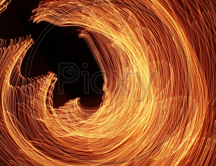 Abstract blurred light trail wavy pattern with black background