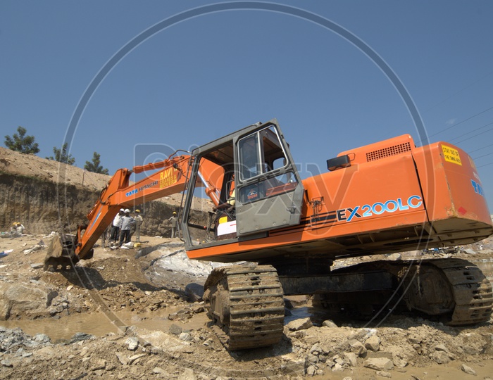 Bulldozer alongside the engineers at a construction site