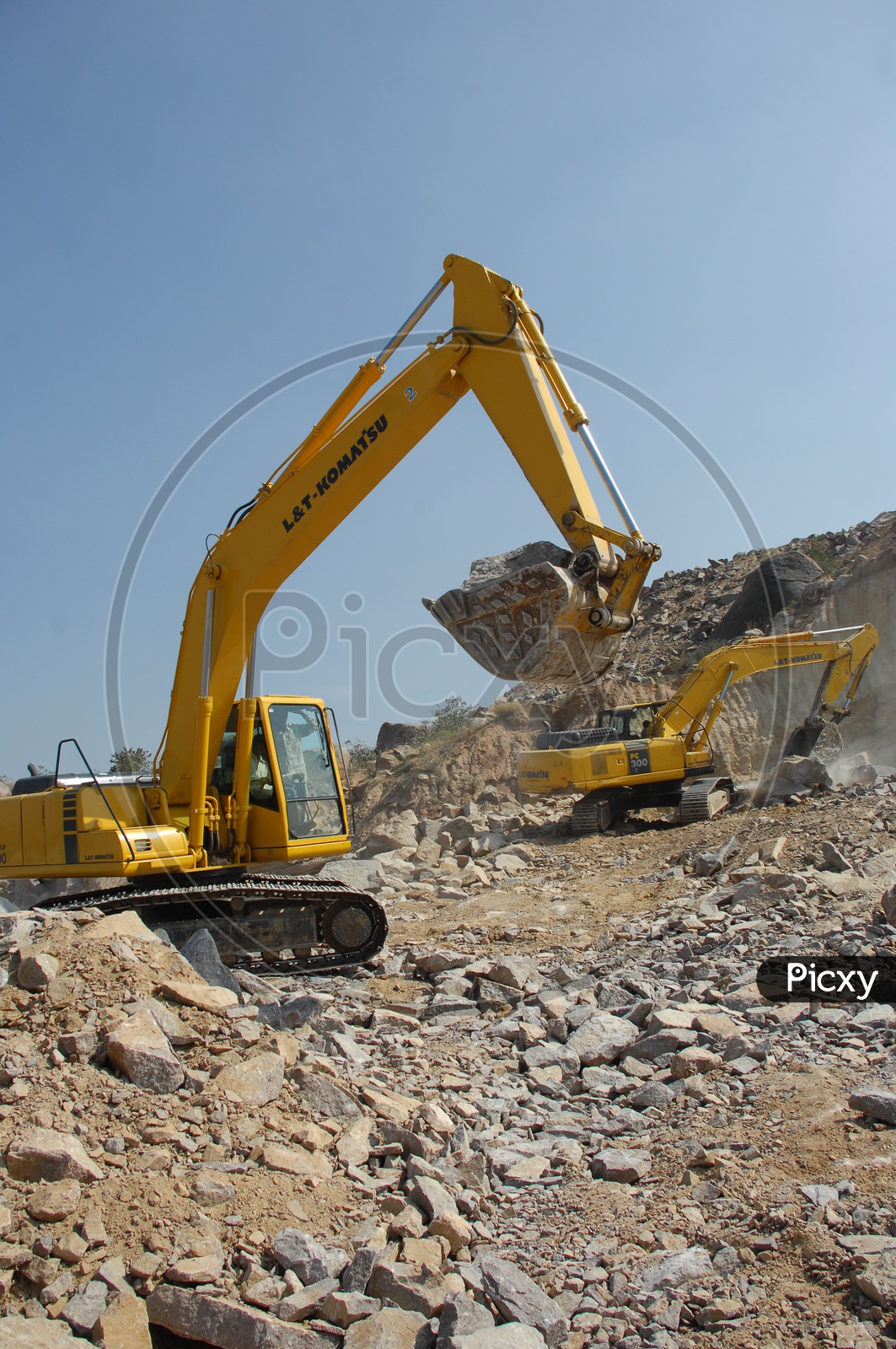 Bulldozer bucket holding the rock material at a construction site