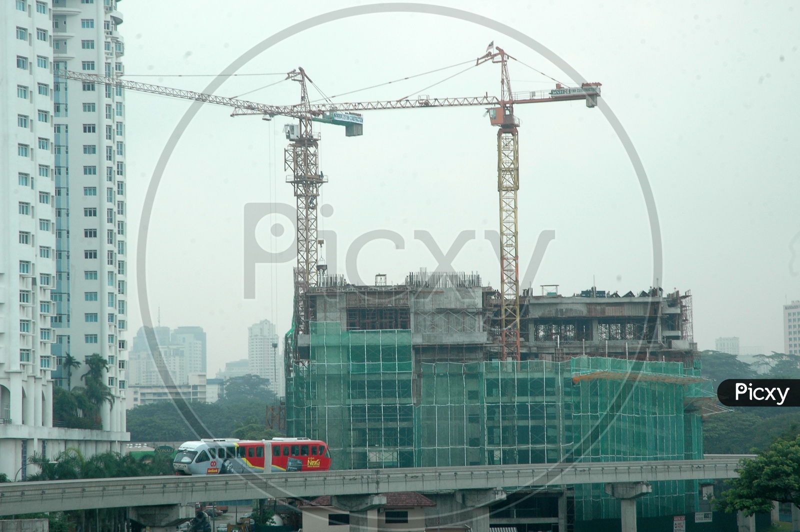 Tower Cranes alongside the high rise buildings