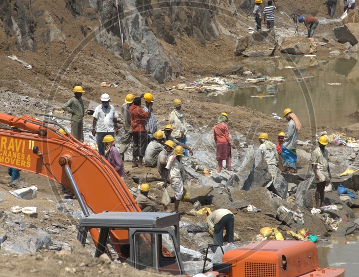 Labourers working in an excavation site