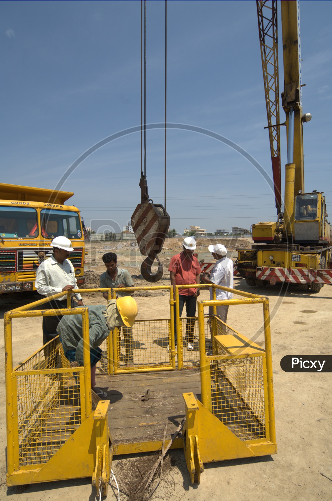 Construction engineers and crane operators inspecting the crane equipment