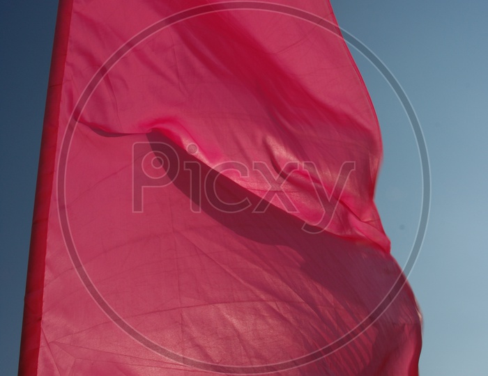 Pink flag waving in the wind