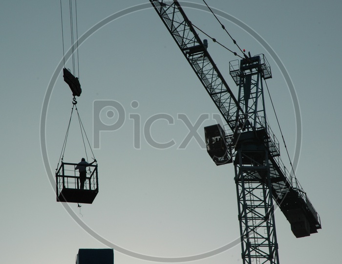Engineers inspecting the construction site on the tower crane