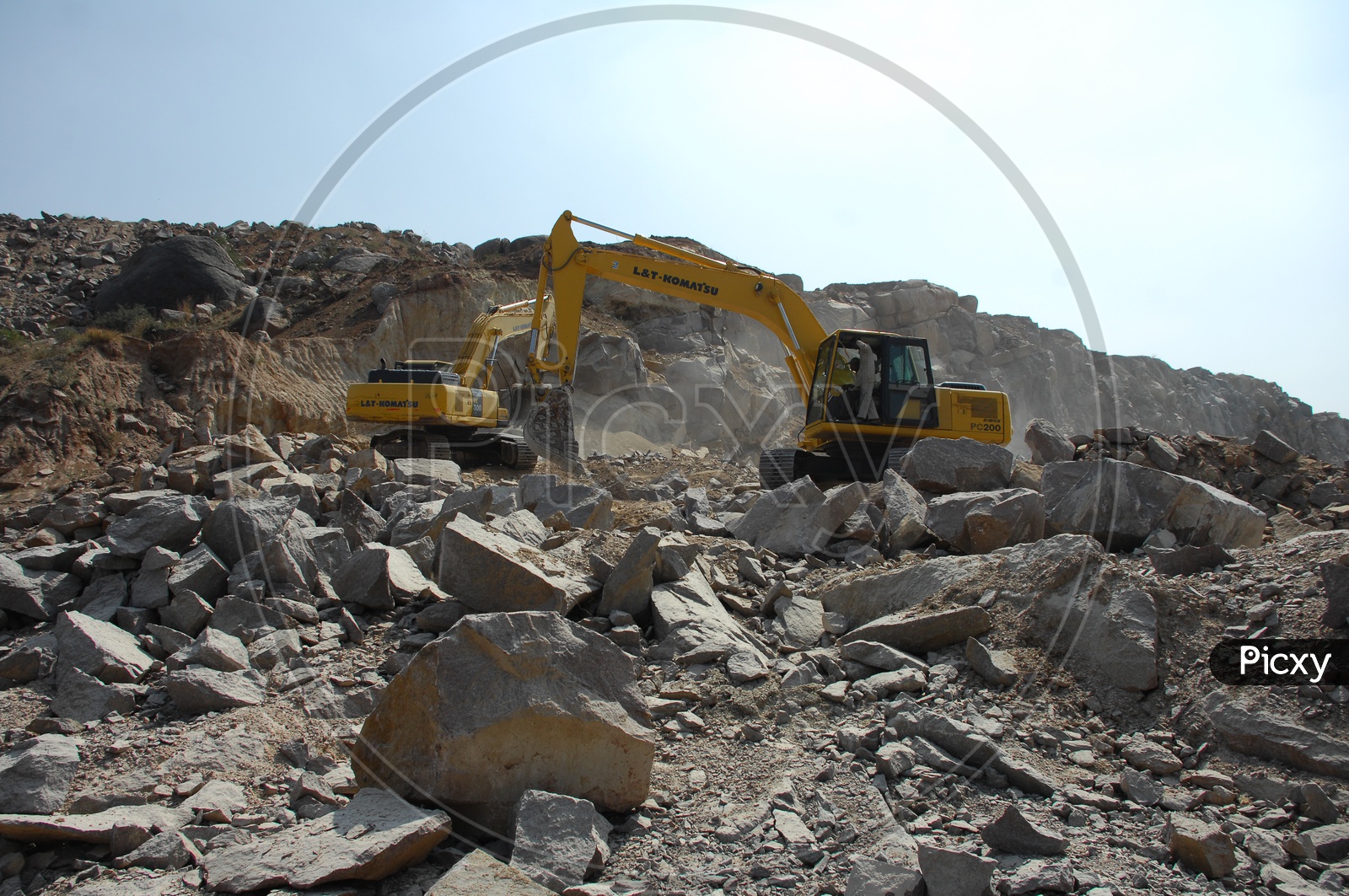 Bulldozer quarrying the construction rocks at an excavation site