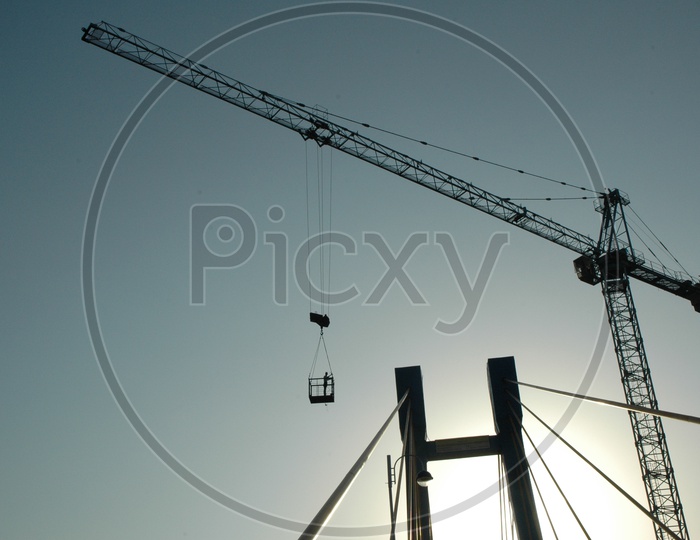 Man in the tower crane with blue sky