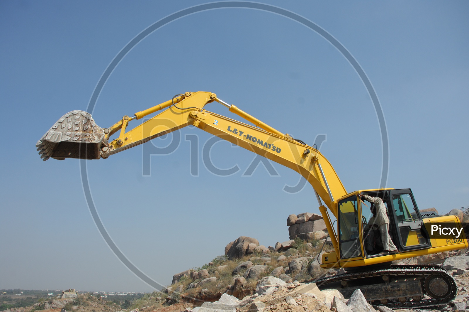 Bulldozer operator operating the bulldozer at a construction site