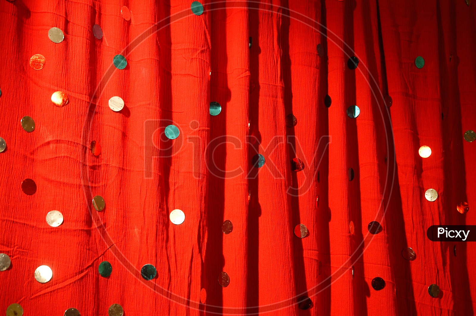 Embroidery beads on the red curtain