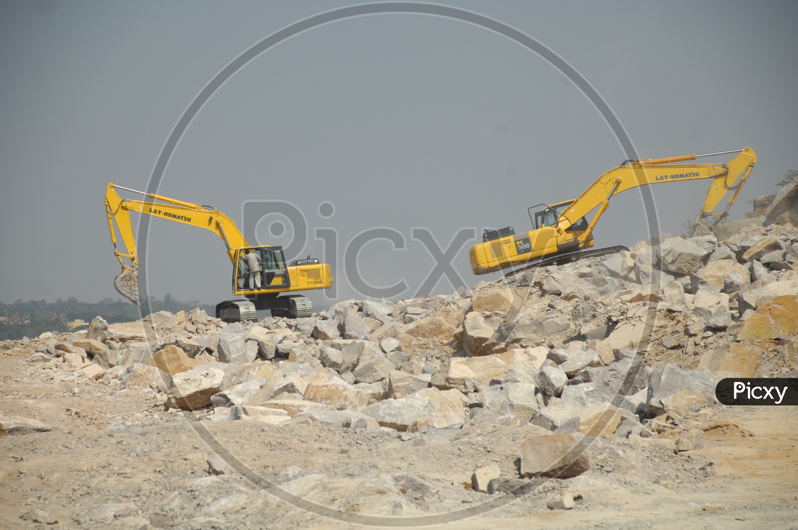 Two bulldozers working opposite to each other at a construction site