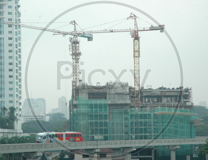 Tower Cranes alongside the construction of hi rise buildings