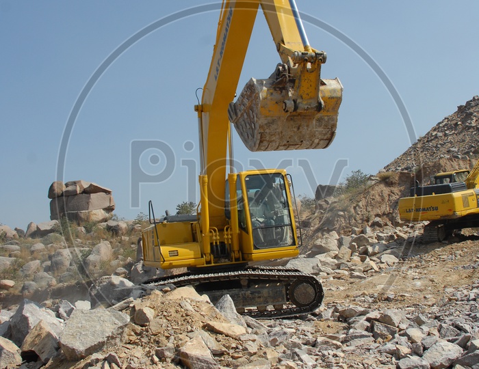 Bulldozer bucket holding the rock material at a construction site