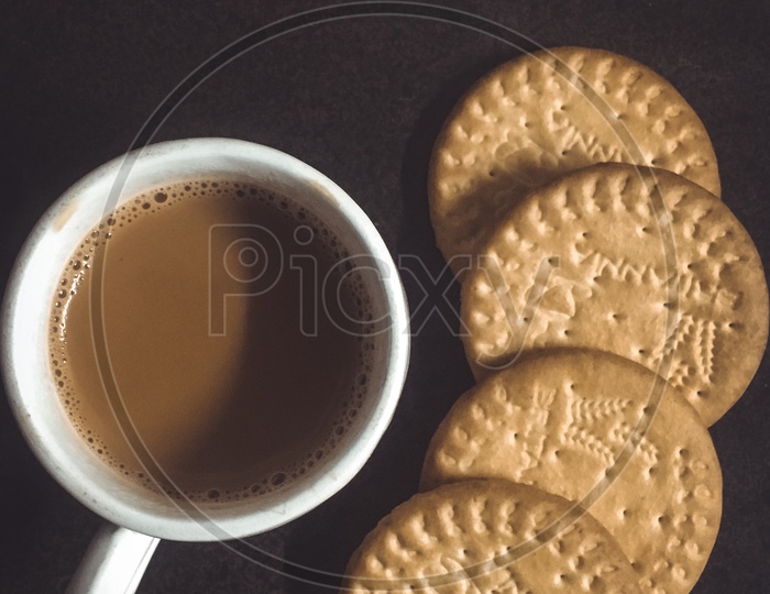 Cup of tea alongside the Marigold Biscuits