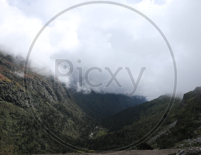 Landscape of beautiful Mountains of Sikkim mountains with huge clouds