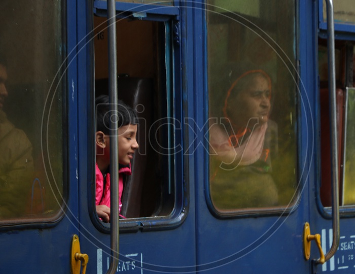 A Boy looking from a Window Of a Train in Ooty