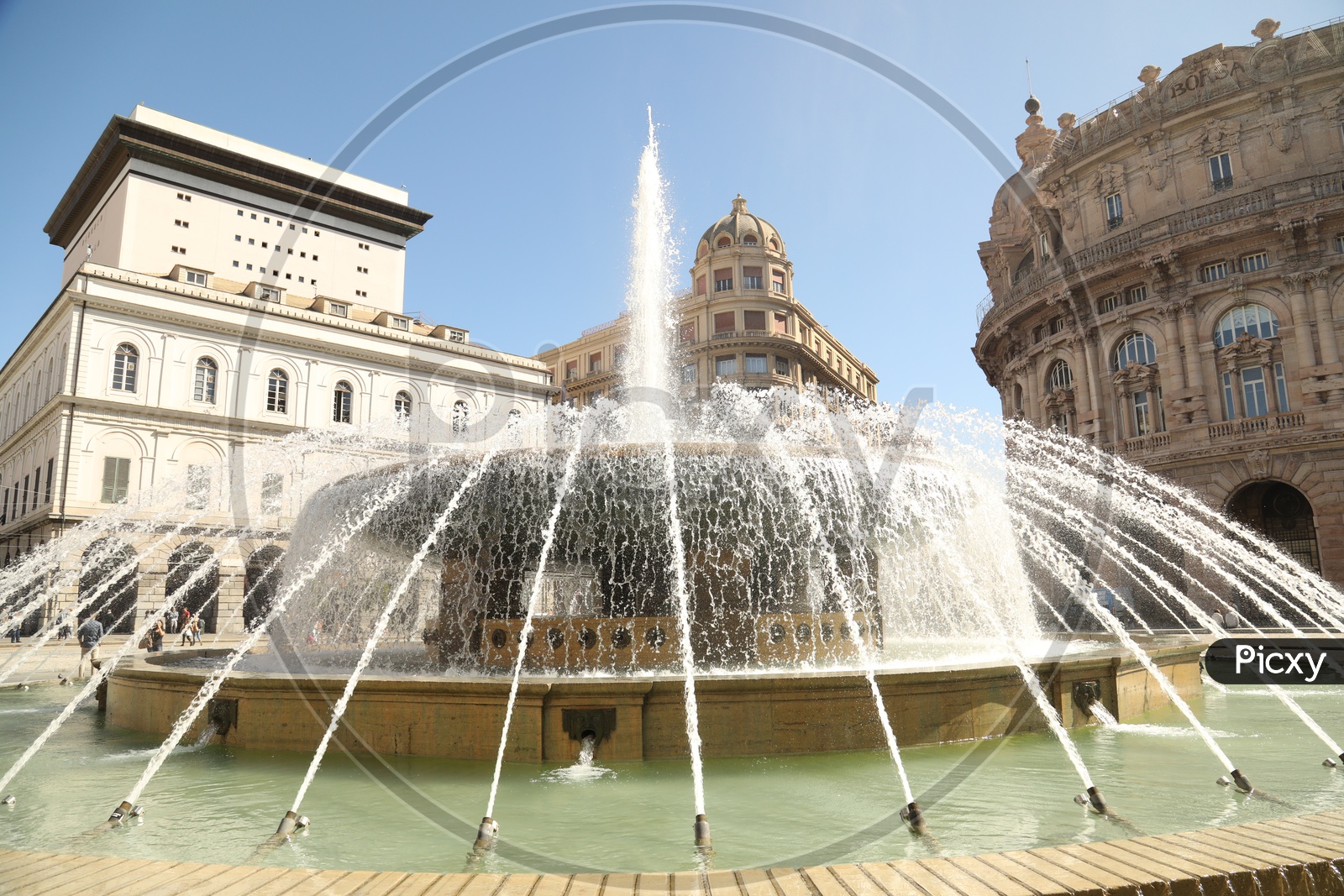 Water fountain alongside a Palace