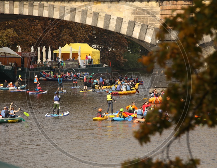Tourists Kayaking through the bridge