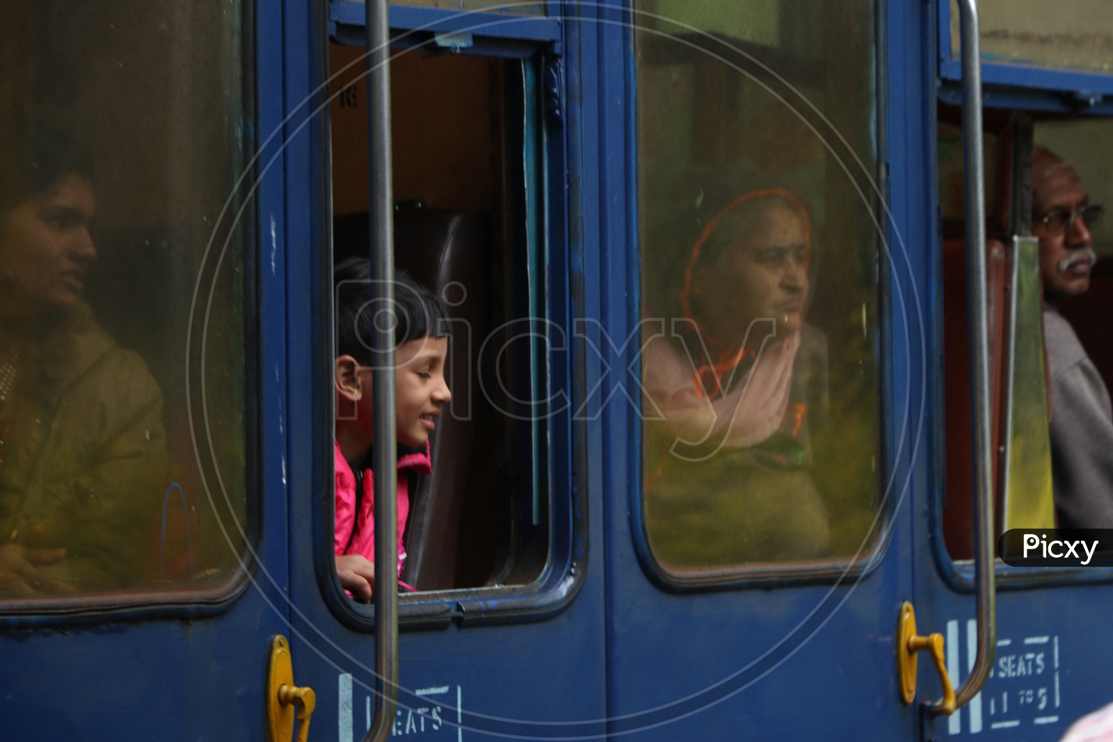 A Boy looking from a Window Of a Train in Ooty