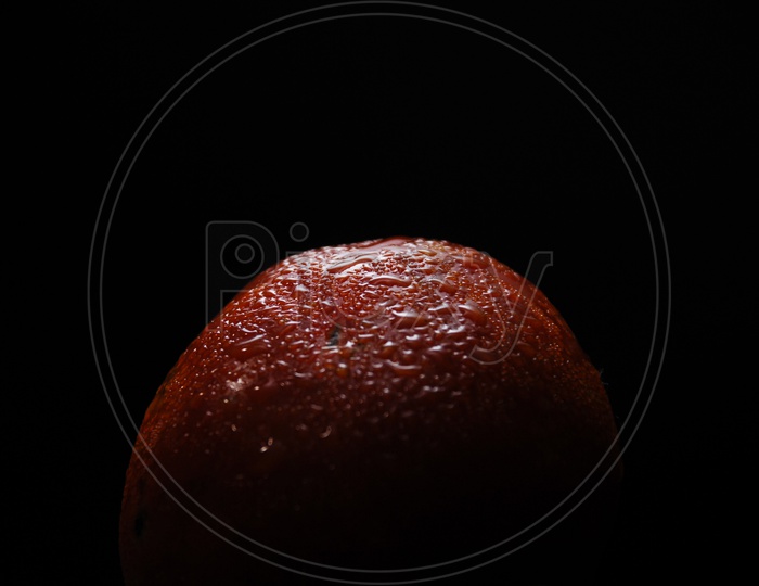 Close up shot of Red Apple with water on it