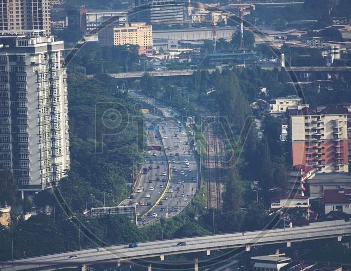 Aerial View of City With  Roads and Vehicles on Road