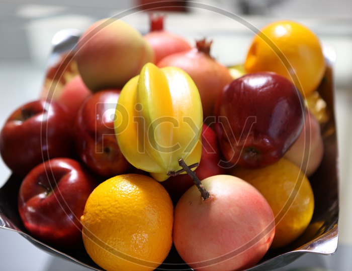 Artificial  Fruits in a bowl On a table