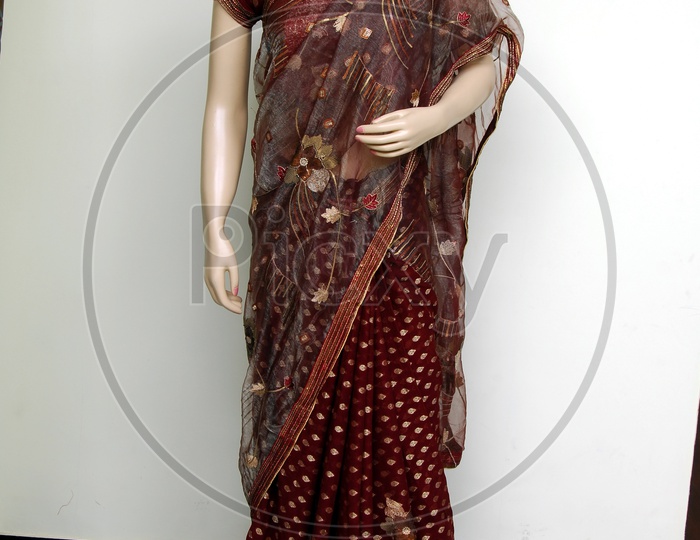 Photograph of maroon colour saree