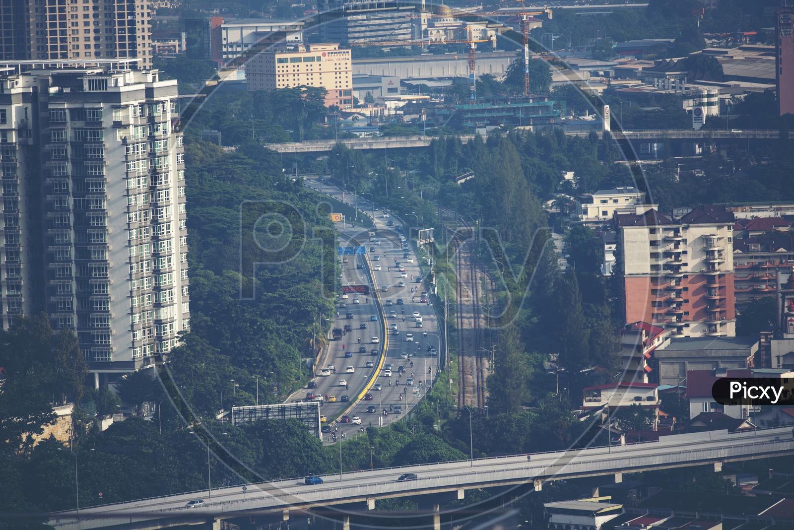 Aerial View of City With  Roads and Vehicles on Road