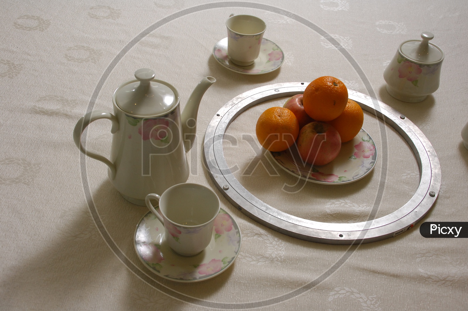 Orange fruits placed in a plate on Dining Table