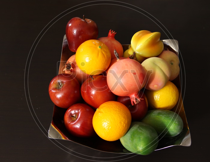 Artificial  Fruits in a bowl On a table