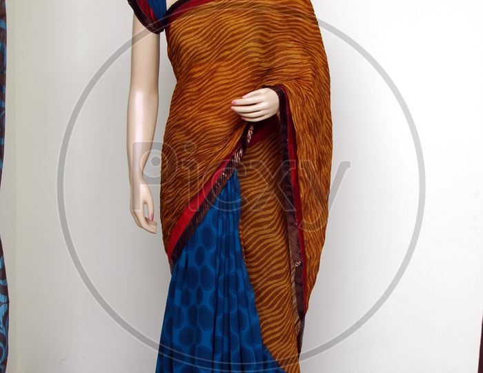 Photograph of blue and orange colour saree